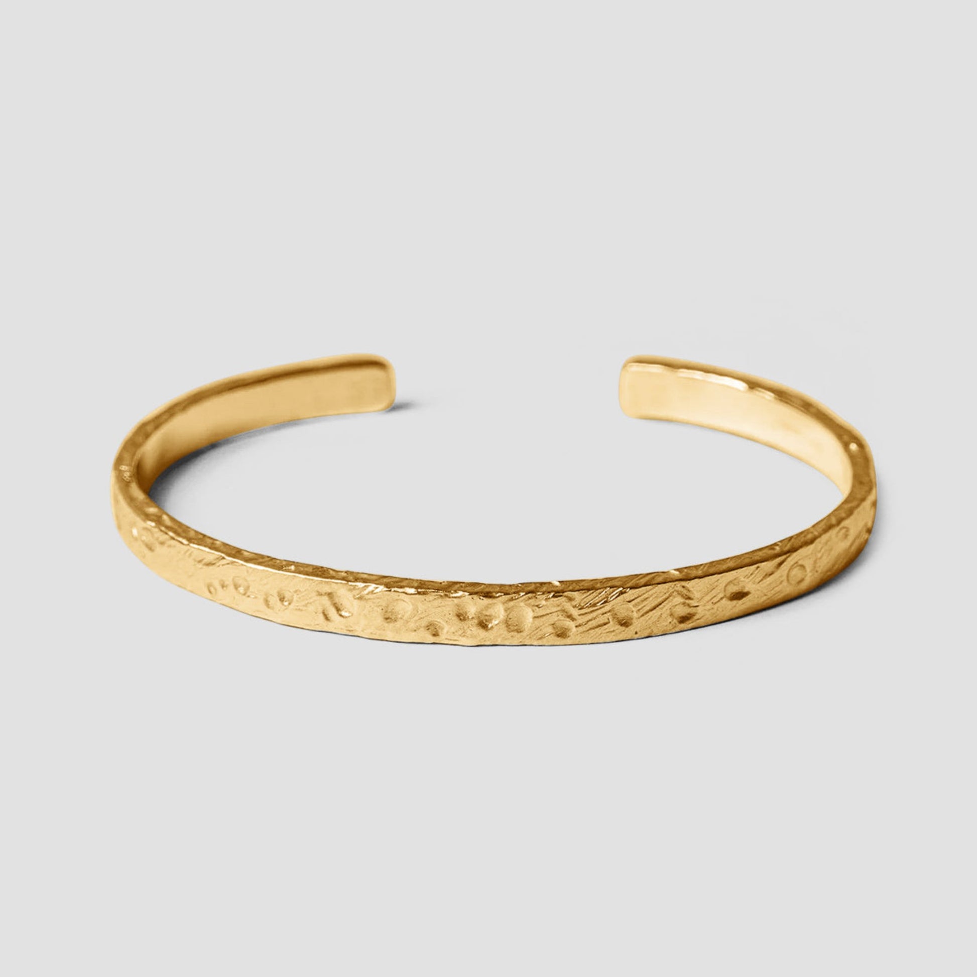 Mickey Cuff in gold with sandblasted texture