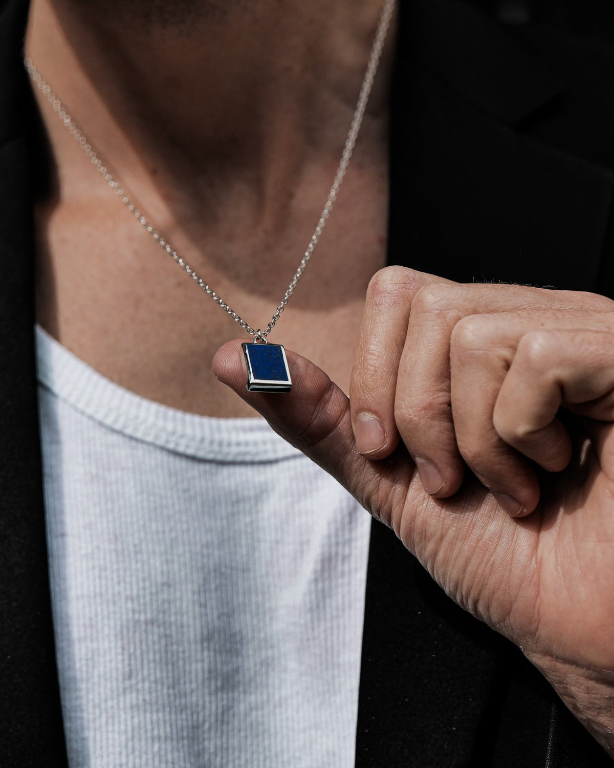 Model wearing the Lapis Lazuli Pendant handcrafted from solid 925 sterling silver on a sterling silver necklace.