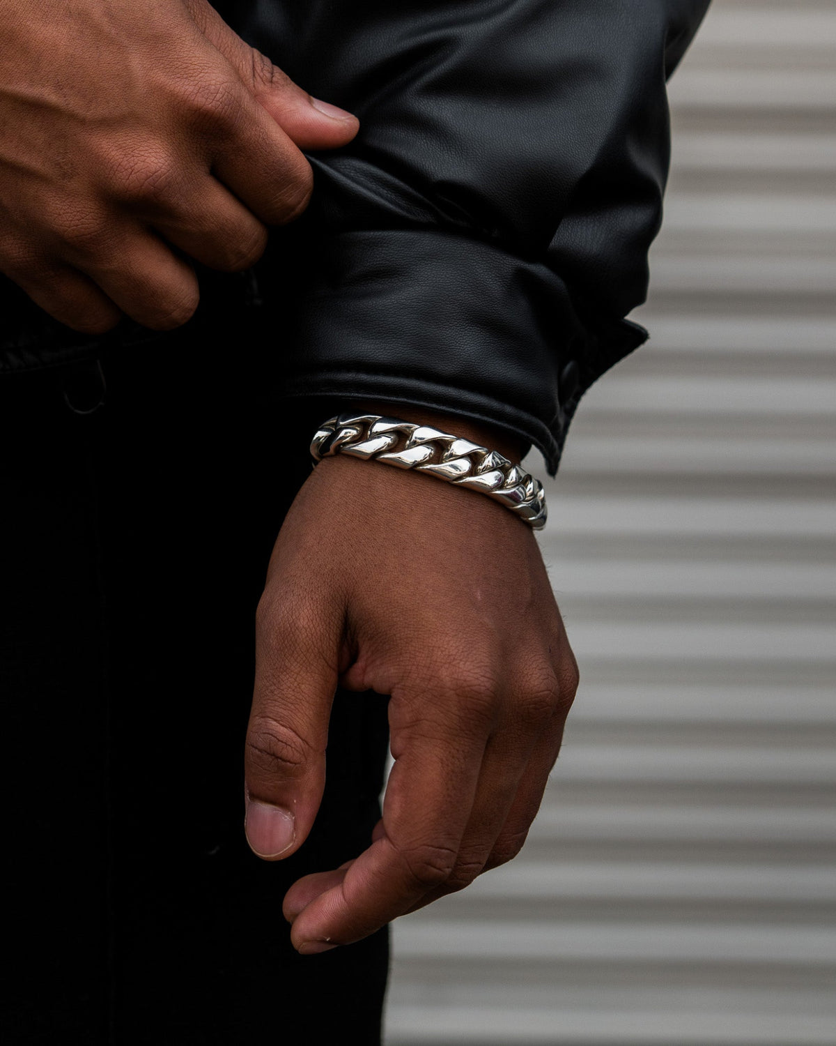 Model wearing the Large Cuban Bracelet handcrafted from solid 925 sterling silver with heavyweight Cuban links.