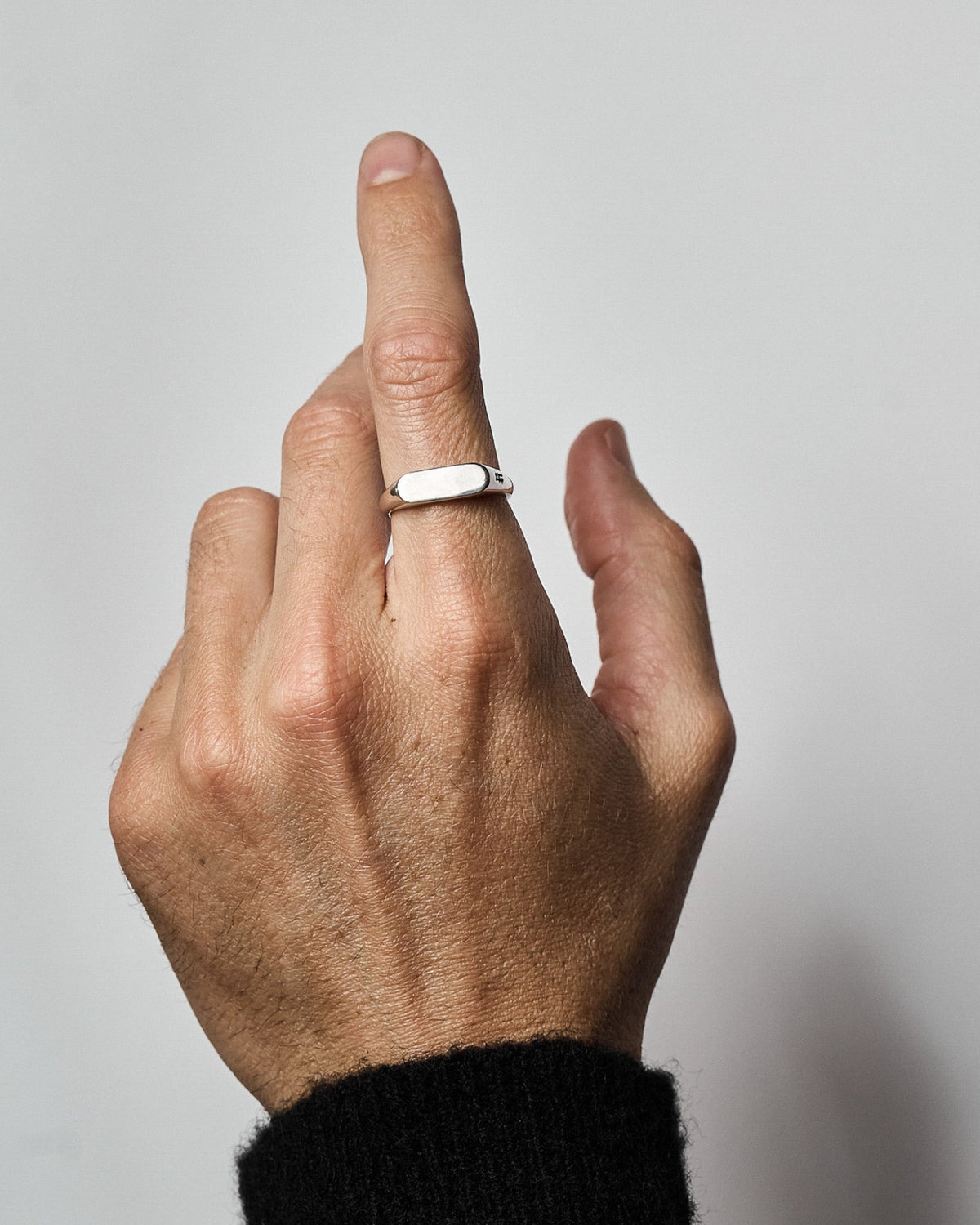 Lenny Ring handcrafted from solid 925 sterling silver with a polished rectangular signet face.