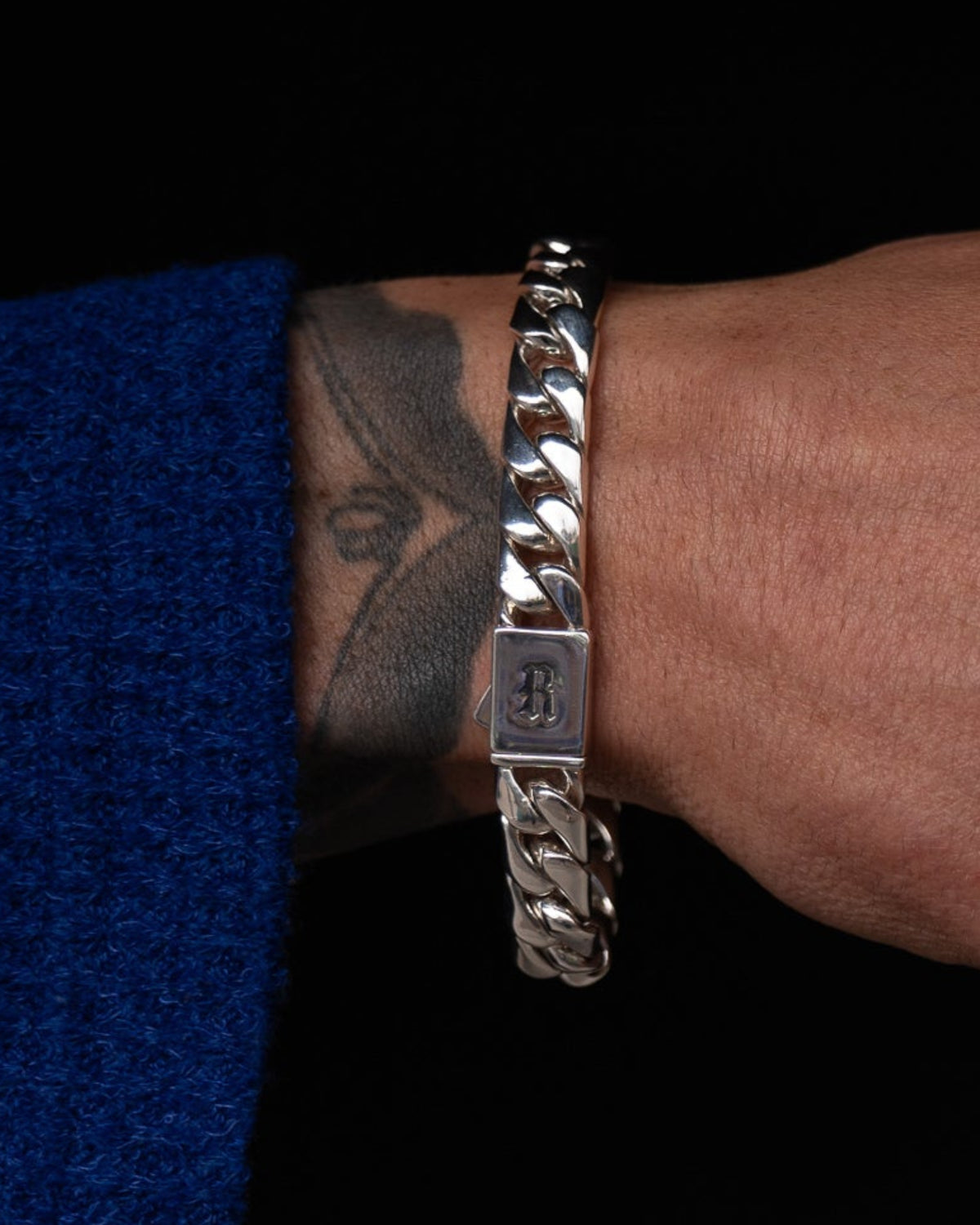 Close-up of the Medium Cuban Bracelet custom clasp in solid sterling silver.