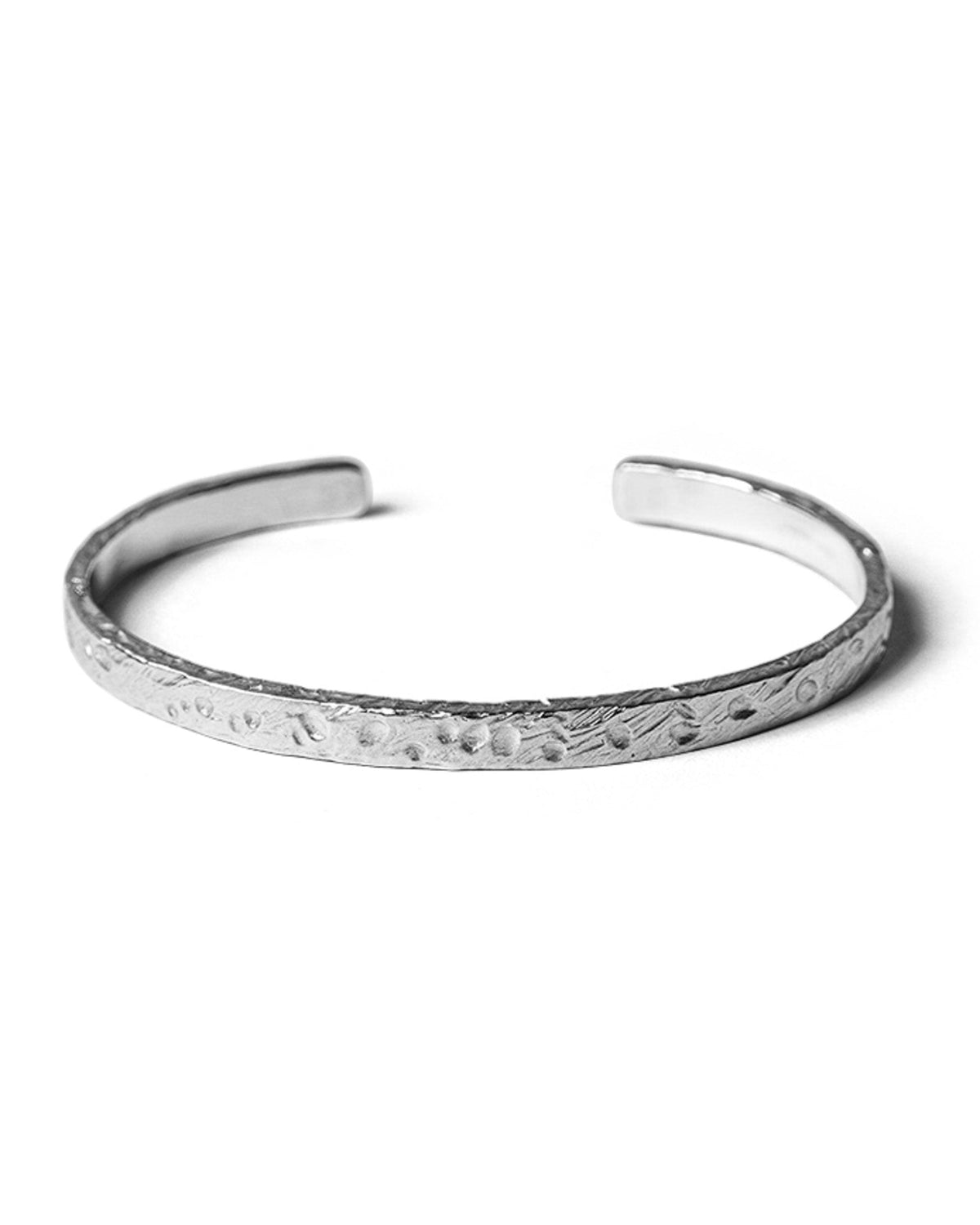 Close-up of the Mickey Cuff handcrafted textured sterling silver finish.
