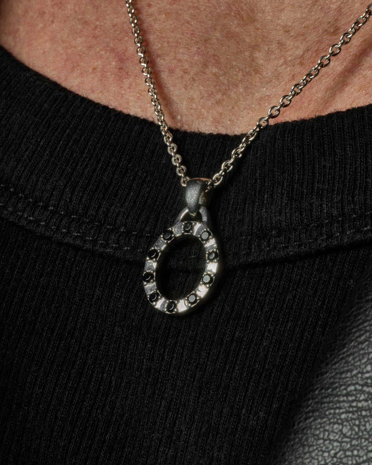 Close-up of the Octavia Pendant featuring black stones set in solid 925 sterling silver.