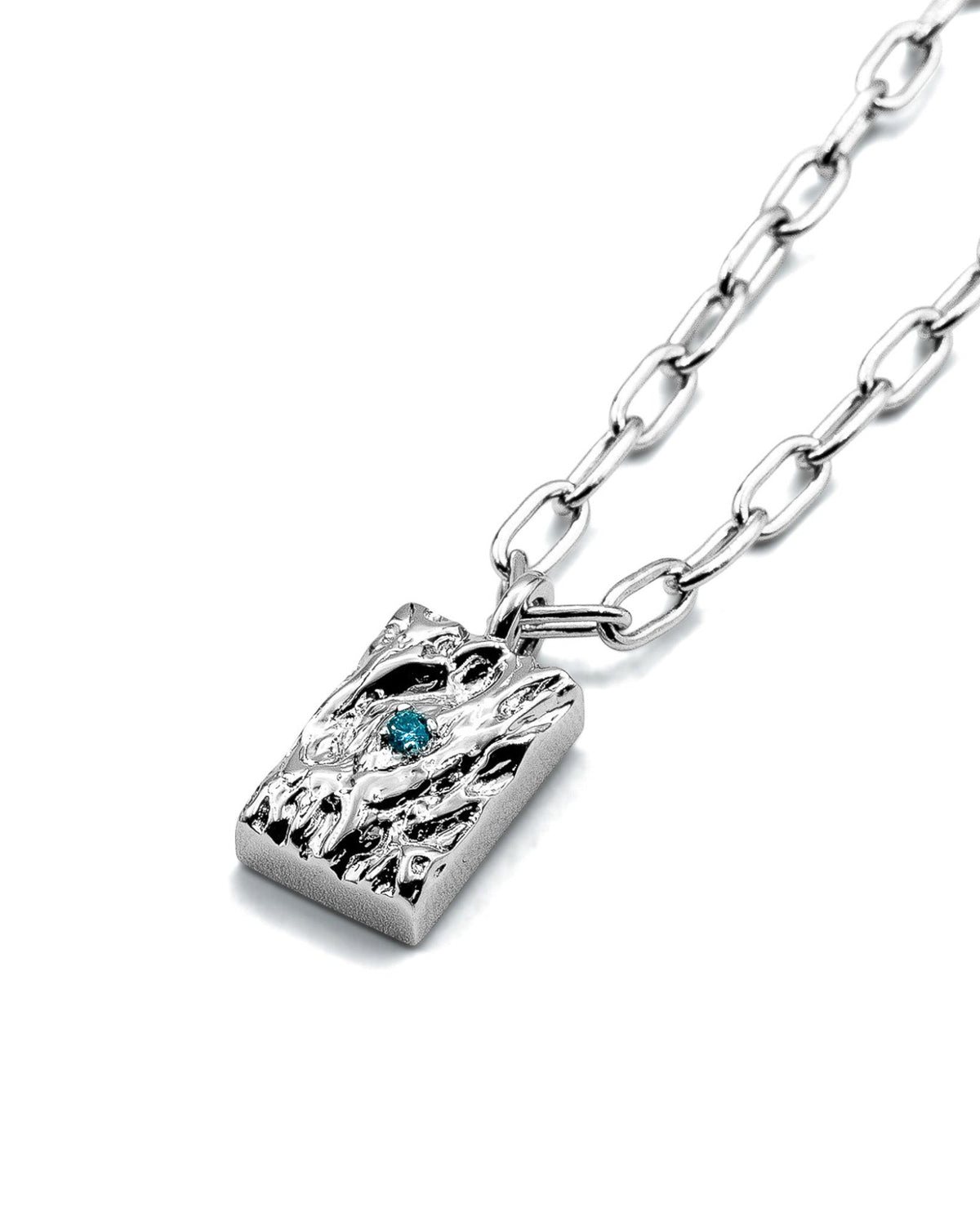 Rayne Pendant handcrafted from solid 925 sterling silver featuring an organic textured design and blue stone.