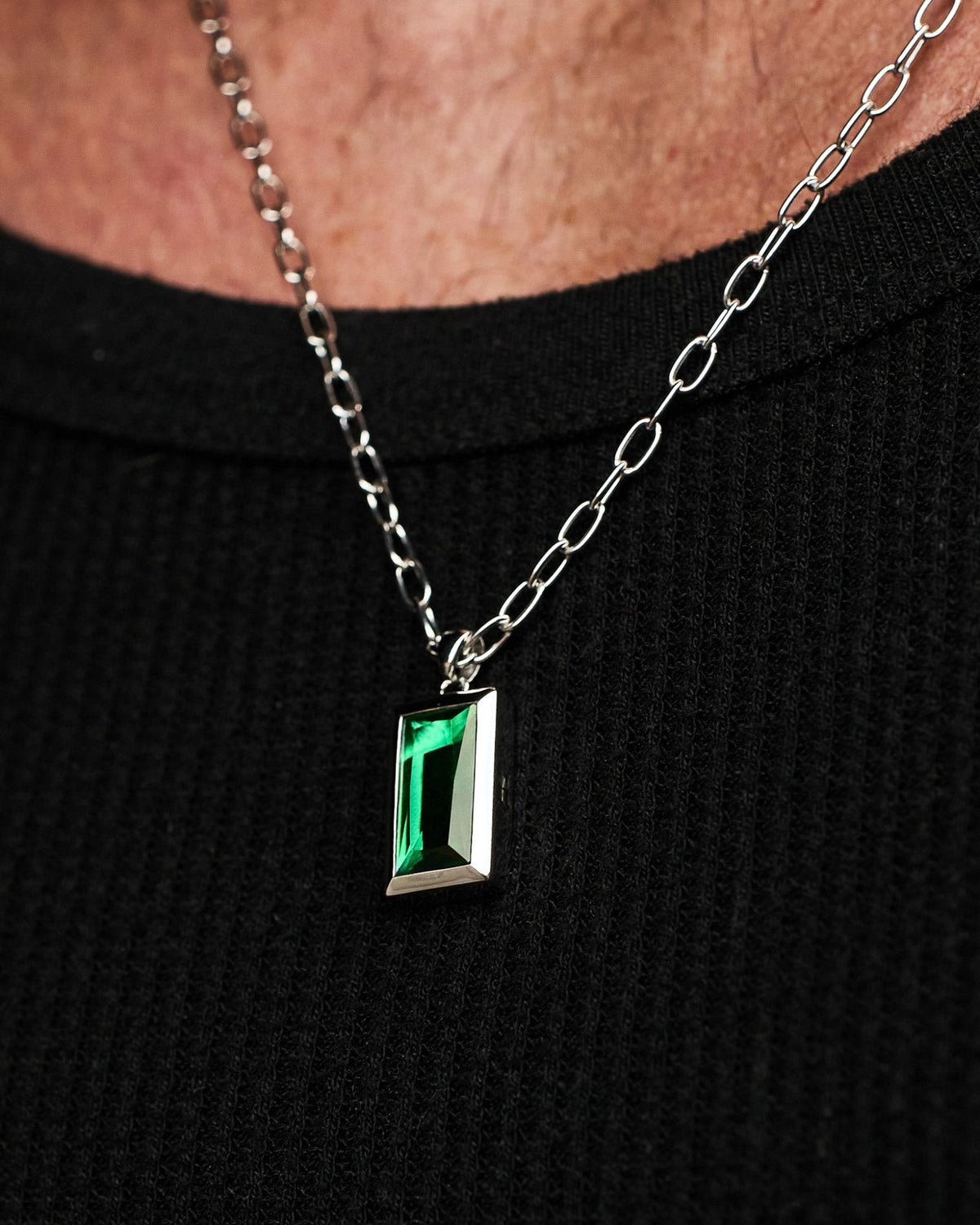 Close-up of the Sona Emerald Pendant featuring an emerald-coloured stone set in solid 925 sterling silver.