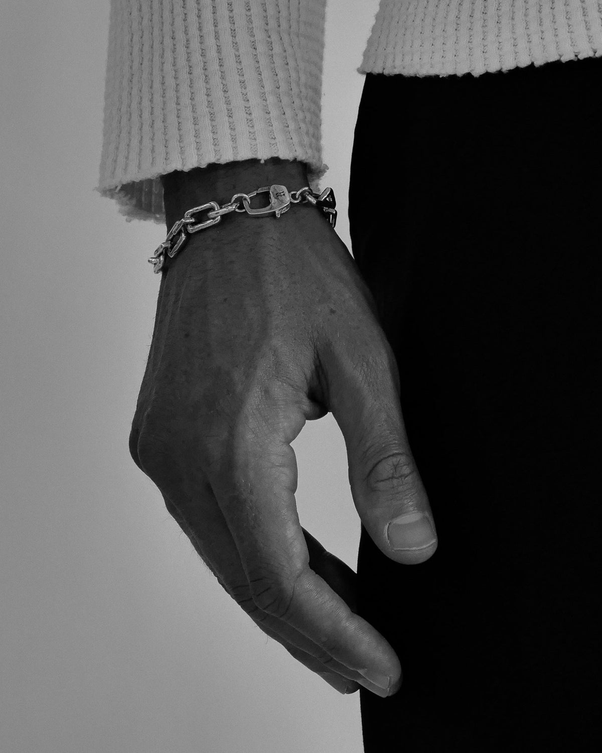 Model wearing the Curtis Bracelet handcrafted from solid 925 sterling silver with oversized paperclip chain links.