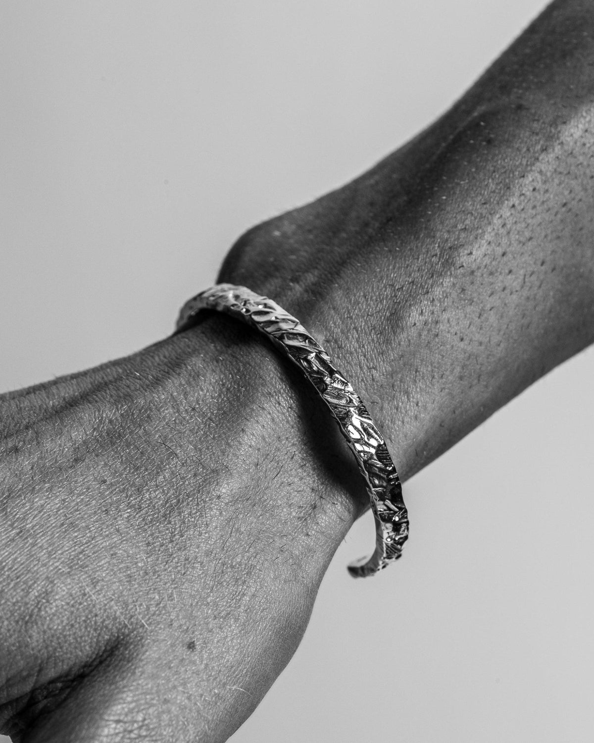 Model wearing the Jasper Cuff handcrafted from solid 925 sterling silver with an organic textured finish.