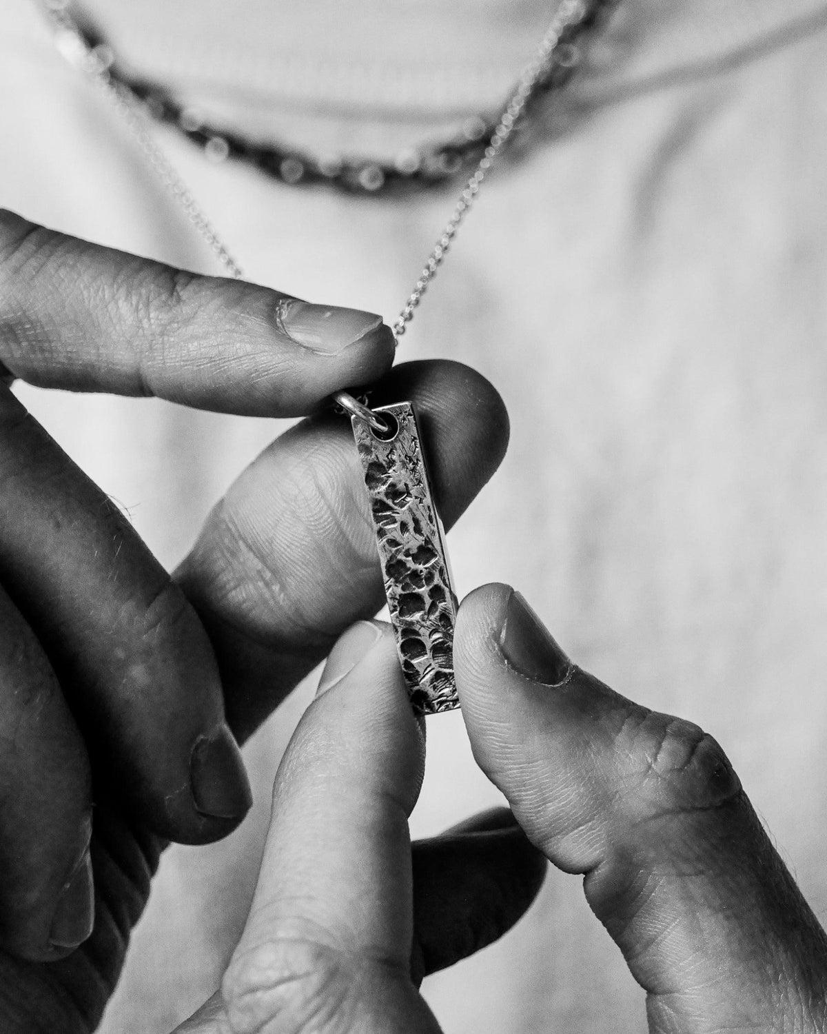 Close-up of the Levi Pendant handcrafted from solid 925 sterling silver with an organic textured finish.